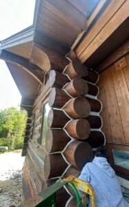 Close-up of log cabin exterior with detailed woodwork
