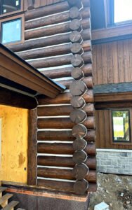 Newly constructed log cabin corner with rustic wood design