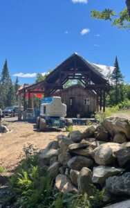 Construction of a wooden cabin with modern equipment in a forest setting