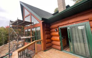 Wooden cabin exterior with construction scaffolding