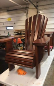 Wooden Adirondack chair in a garage workshop
