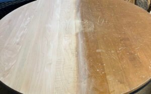 Wooden table with half sanded for refinishing