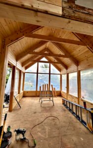 Interior view of a wooden sunroom under construction