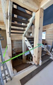 Wooden staircase under construction in a modern building