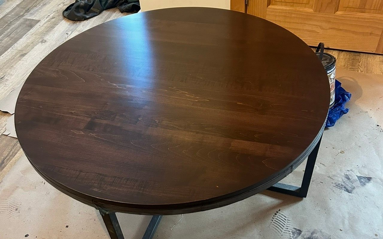 Round wooden table top in a home service setting