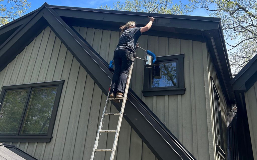 Professional gutter cleaning for residential house exterior maintenance